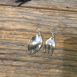 Four pieces - Fork and spoon and end of silverware cuffs silver